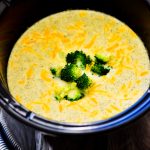 Slow Cooker Broccoli Cheese Soup is a creamy soup made with fresh broccoli, carrots and freshly grated sharp cheddar cheese. Life-in-the-Lofthouse.com