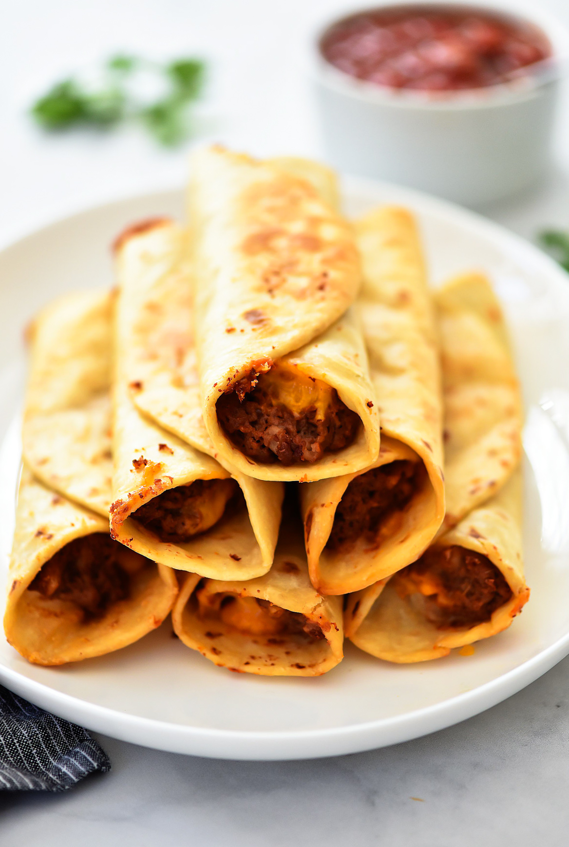 Crisp Bean Burritos are filled with cheesy refried beans all wrapped inside a flour tortilla then deep-fried. Life-in-the-Lofthouse.com