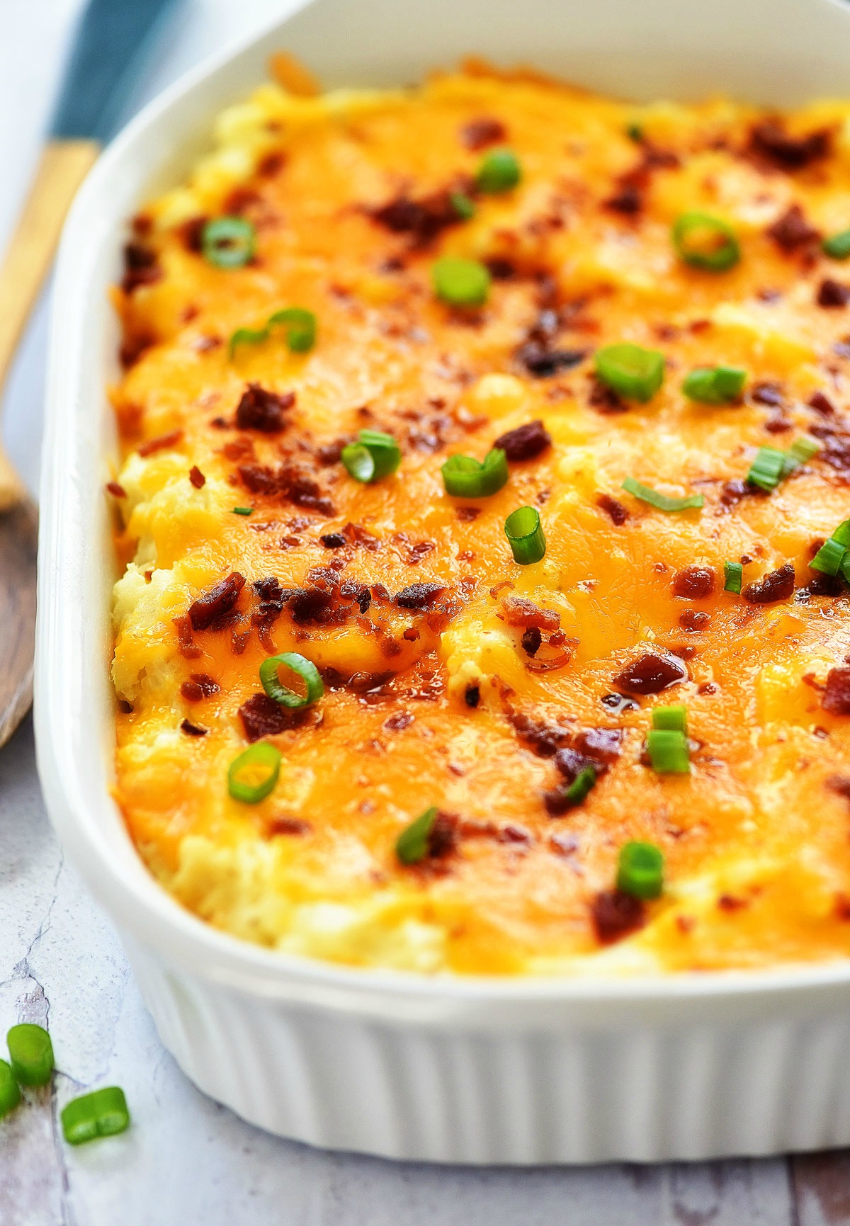 Twice-Baked Potato Casserole is filled with creamy potatoes, cheese and crispy bacon. Life-in-the-Lofthouse.com
