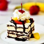 Banana Split Ice Cream Sandwich Cake has layers of ice cream sandwiches, Cool Whip and fresh fruit. Life-in-the-Lofthouse.com