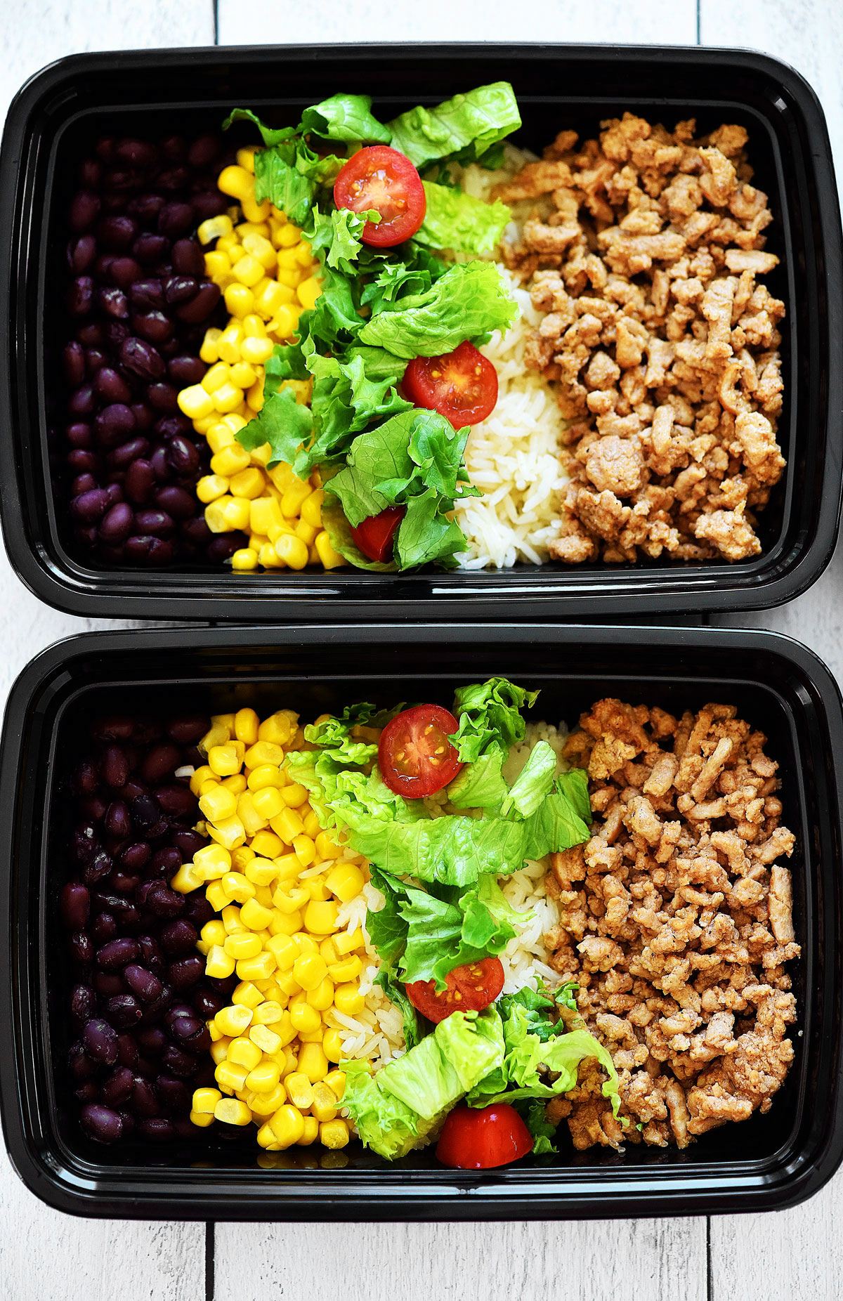 Taco Salad Meal Prep Bowls are filled with seasoned ground turkey, rice, beans, corn and lettuce. Life-in-the-Lofthouse.com