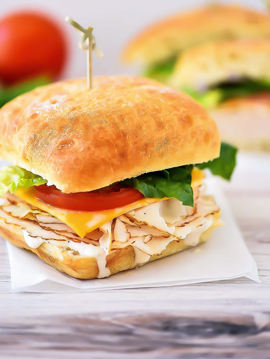 Chicken Caesar Sandwiches are chicken, cheese, lettuce and tomato between two Ciabatta rolls smothered with caesar dressing. Life-in-the-Lofthouse.com
