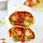 Sticky Chicken Finger Wraps are sweet and spicy glazed chicken fingers wrapped up in a flour tortilla with lettuce, tomato and cheese. Life-in-the-Lofthouse.com