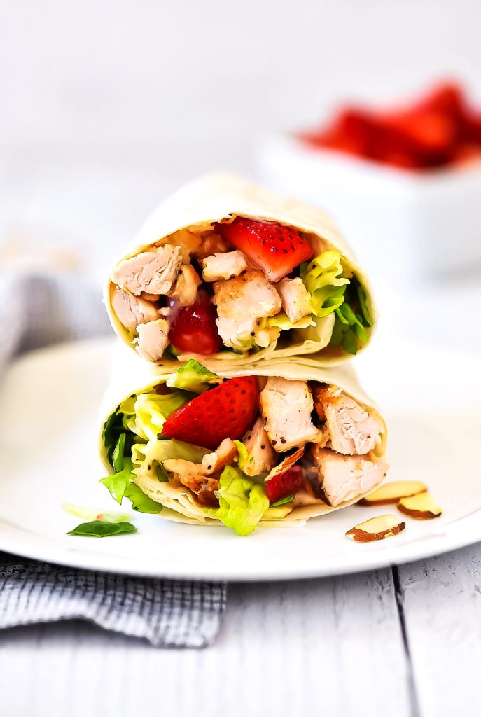 Strawberry Chicken Wraps are filled with grilled chicken, romaine lettuce, creamy poppy seed dressing and strawberries. Life-in-the-Lofthouse.com