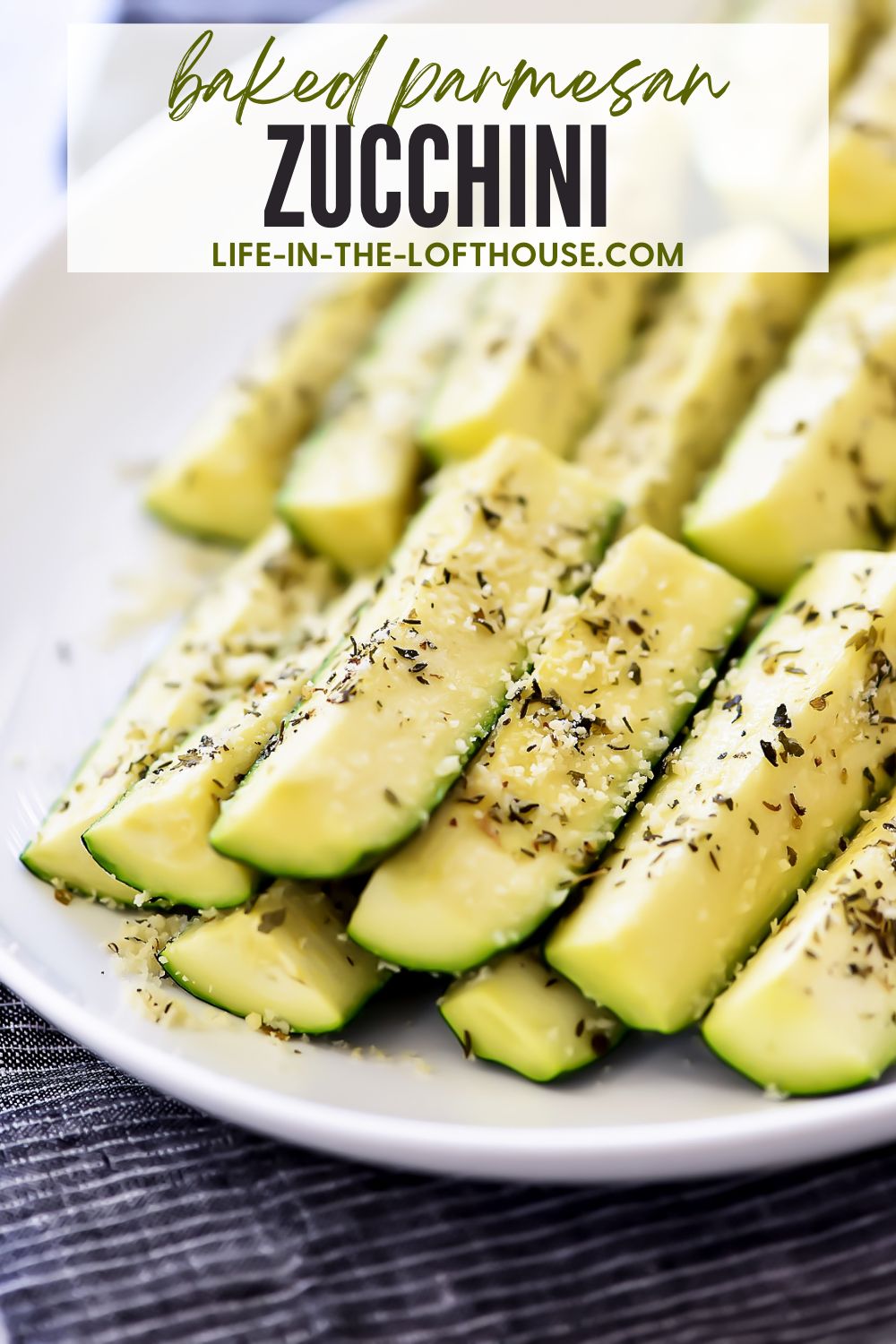 Baked zucchini covered in Parmesan cheese and full of Italian flavor. Life-in-the-Lofthouse.com
