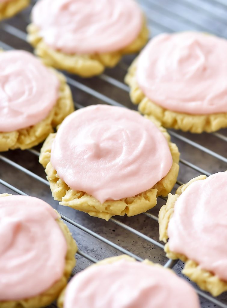 Soft and delicious sugar cookies with a creamy pink frosting. Life-in-the-Lofthouse.com