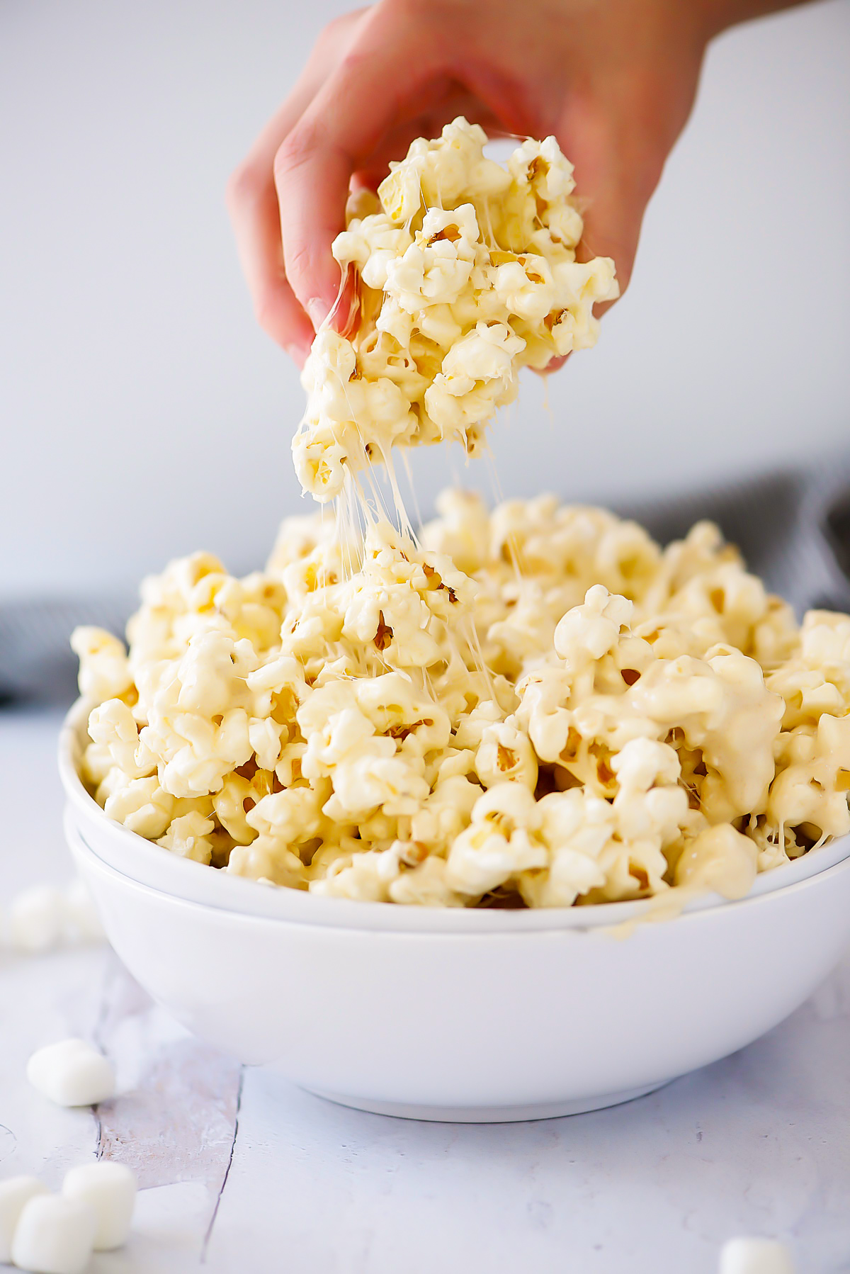 Marshmallow popcorn is warm popcorn covered in a gooey mixture of brown sugar, butter and marshmallows. Life-in-the-Lofthouse.com