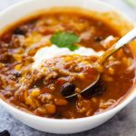 Crock Pot Taco Soup is full of delicious beans, corn, ground beef and wonderful taco seasoning. Life-in-the-Lofthouse.com