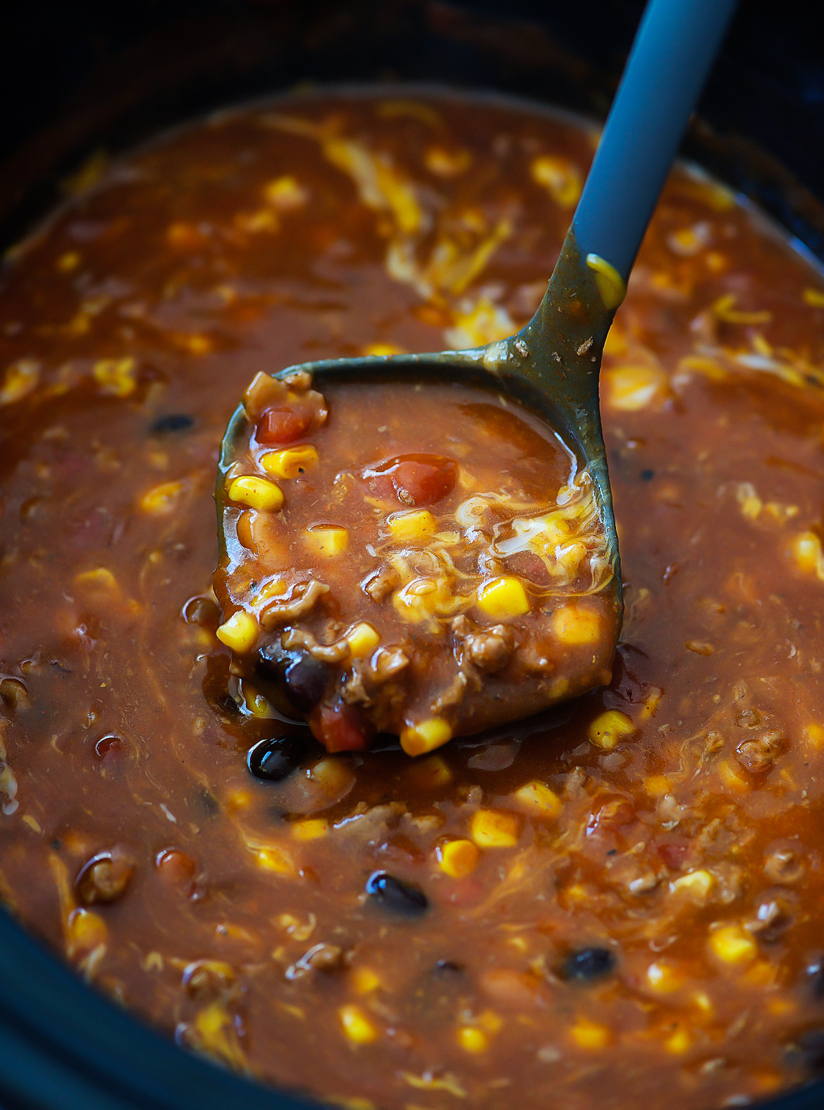 Crock Pot Taco Soup is full of delicious beans, corn, ground beef and wonderful taco seasoning. Life-in-the-Lofthouse.com