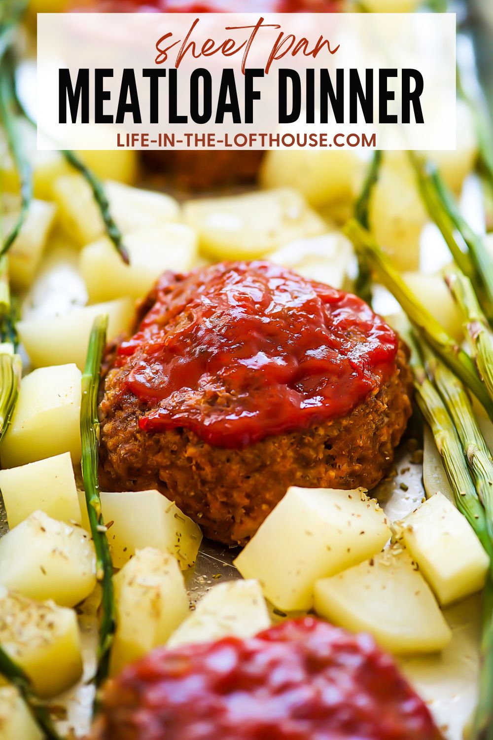 One Pan Meatloaf Dinner with potatoes and asparagus.
