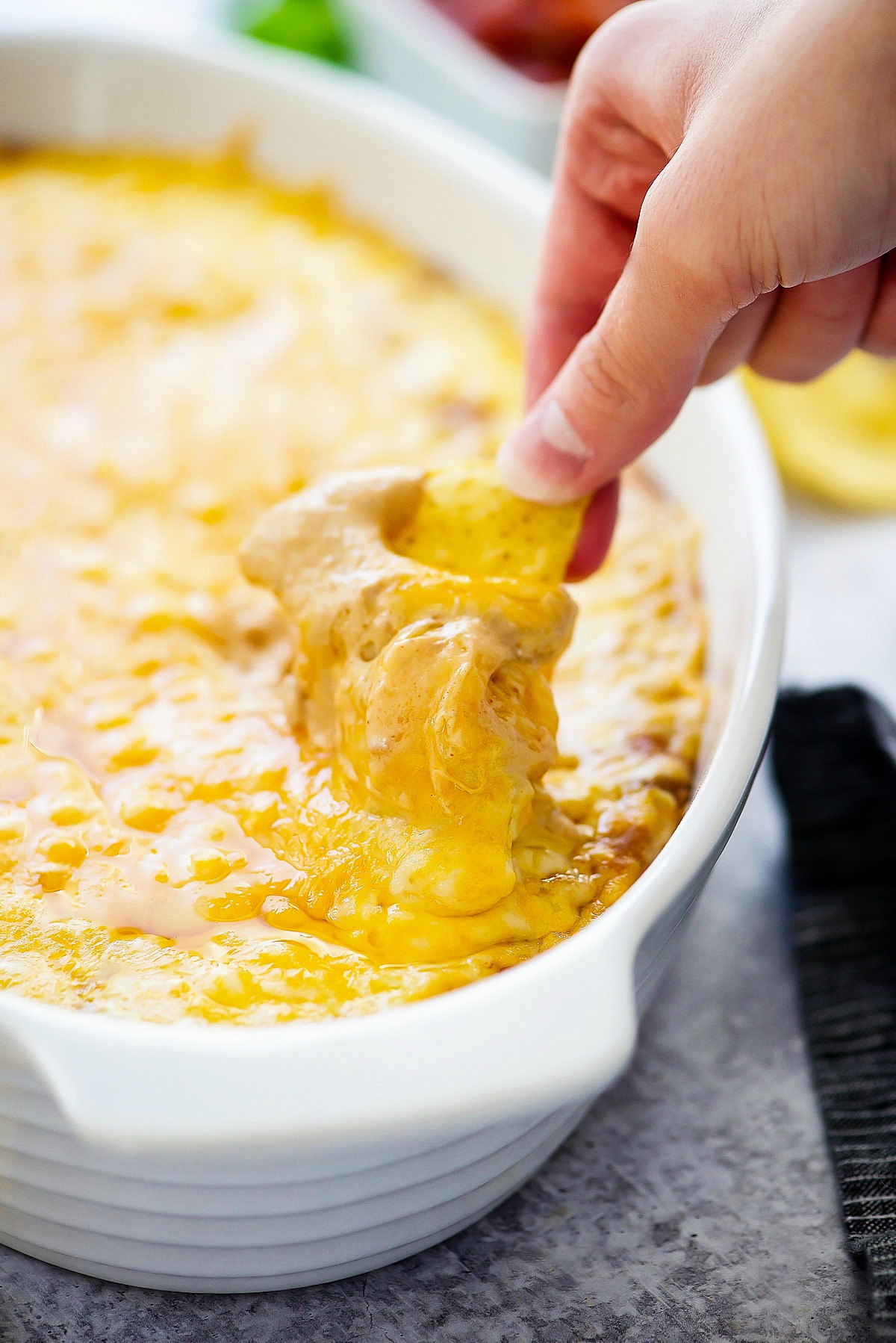 Warm Bean Dip is creamy refried beans mixed with sour cream and Mexican seasonings and melted cheese. Life-in-the-Lofthouse.com