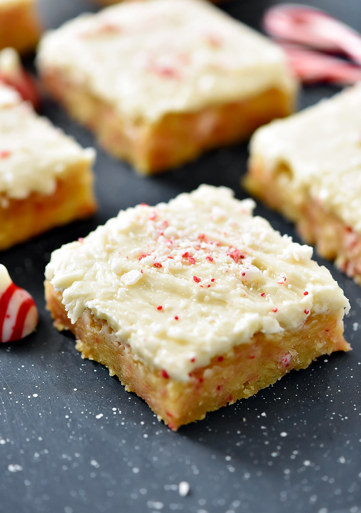 Delicious, soft sugar cookie bars filled and topped with candy cane Hershey kisses. Life-in-the-Lofthouse.com