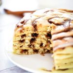 Cinnamon Roll Pancakes have swirls of cinnamon through out and are topped with a delicious cream cheese glaze. Life-in-the-Lofthouse.com