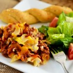 Noodles, ground beef, tomato sauce, sour cream and lots of cheese are all inside this sour cream noodle bake. Life-in-the-Lofthouse.com