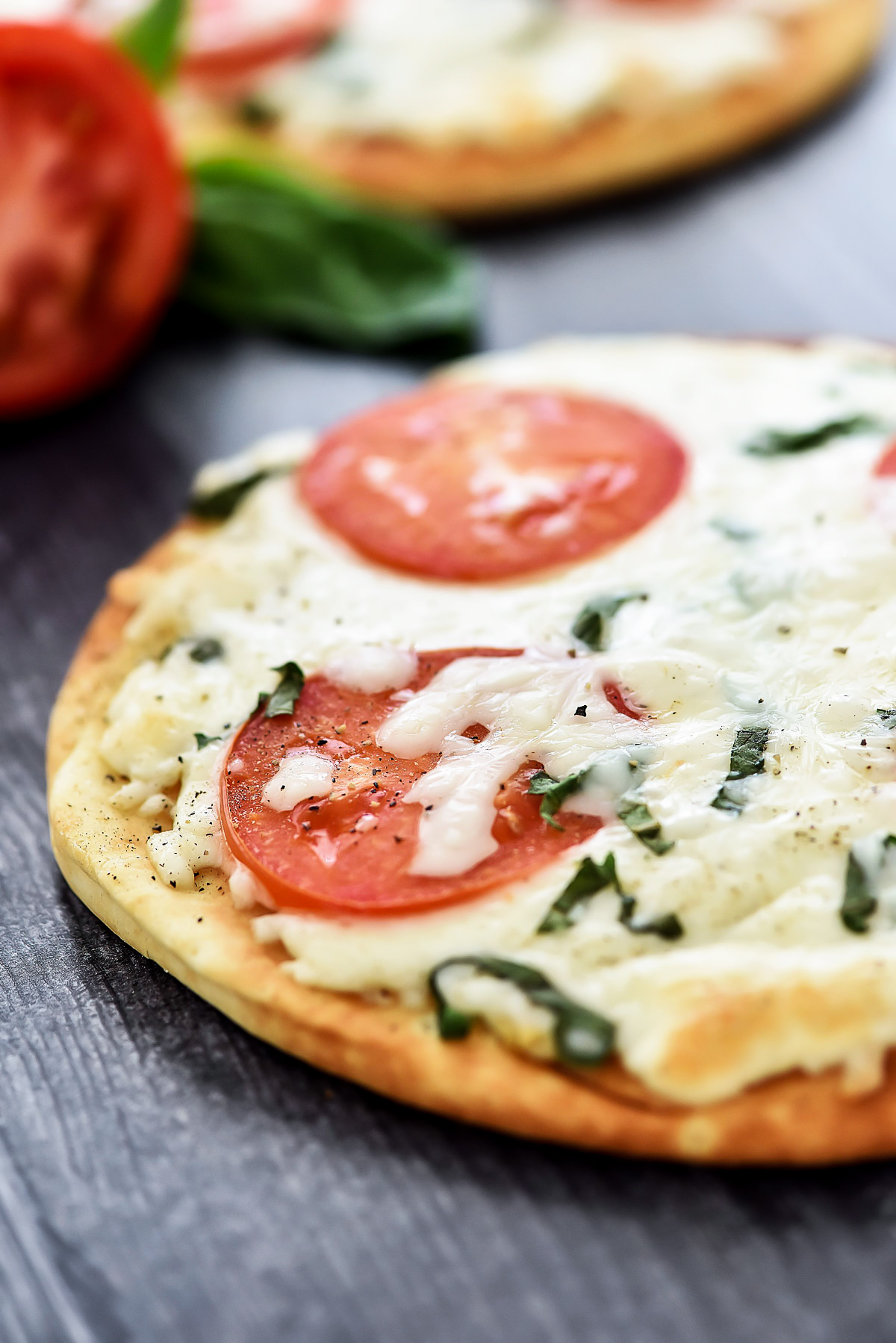 Margherita Flatbread Pizza is topped with Mozzarella and Parmesan cheese, sliced tomatoes and fresh basil over a flatbread crust. Life-in-the-Lofthouse.com