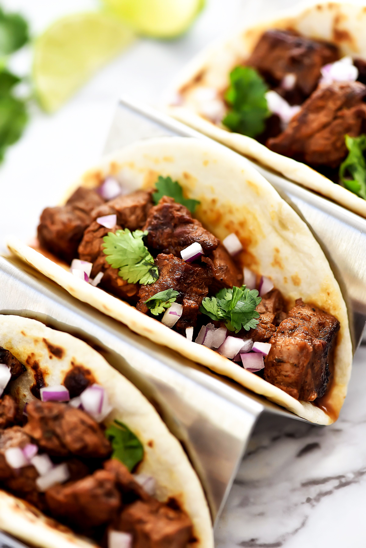 Mexican Street Tacos are filled with carne asada, cilantro and red onion served in corn or flour tortillas. Life-in-the-Lofthouse.com