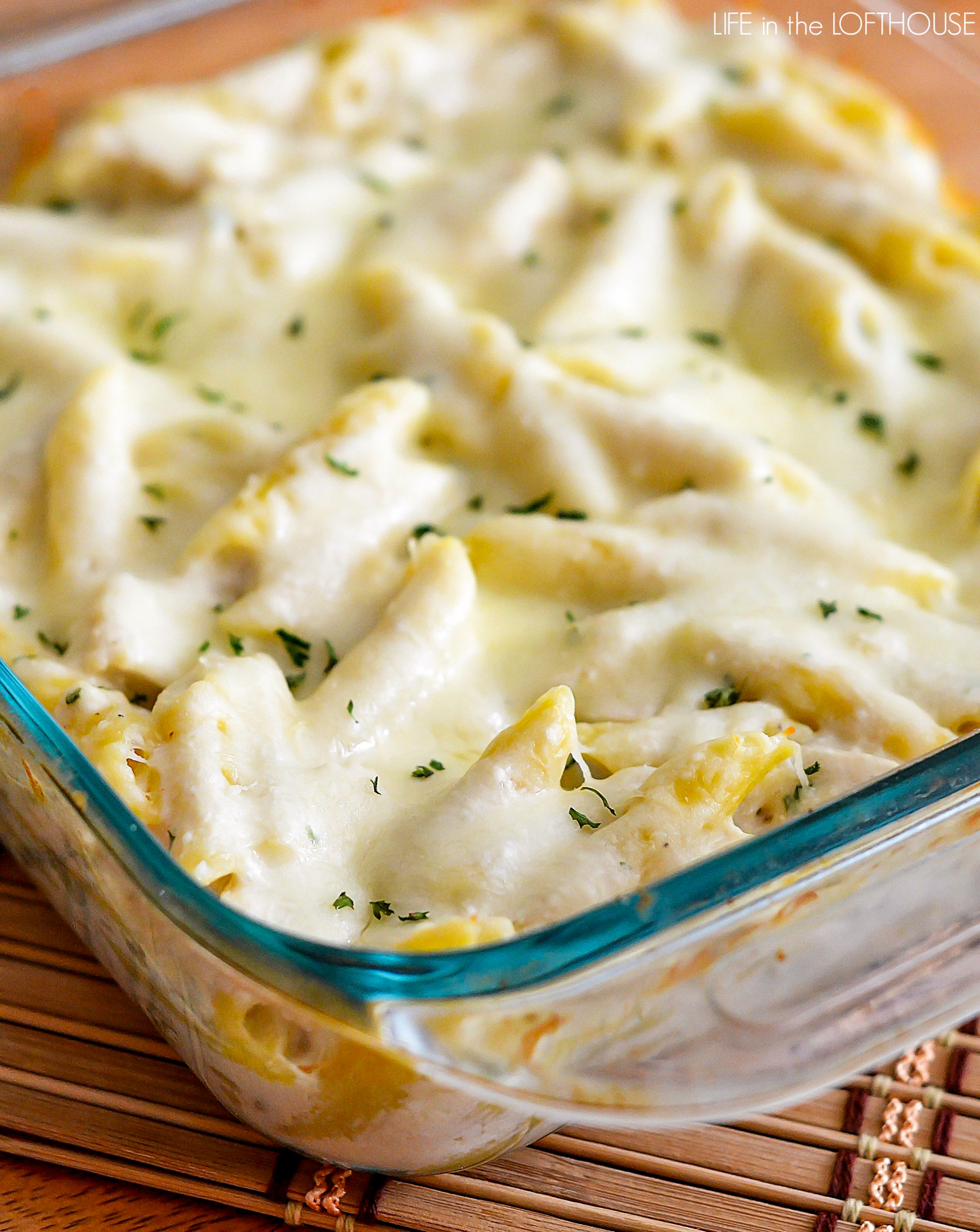 This Three Cheese Chicken Alfredo Bake is cheesy, creamy heaven with Ricotta, Parmesan and Mozzarella cheese. Life-in-the-Lofthouse.com