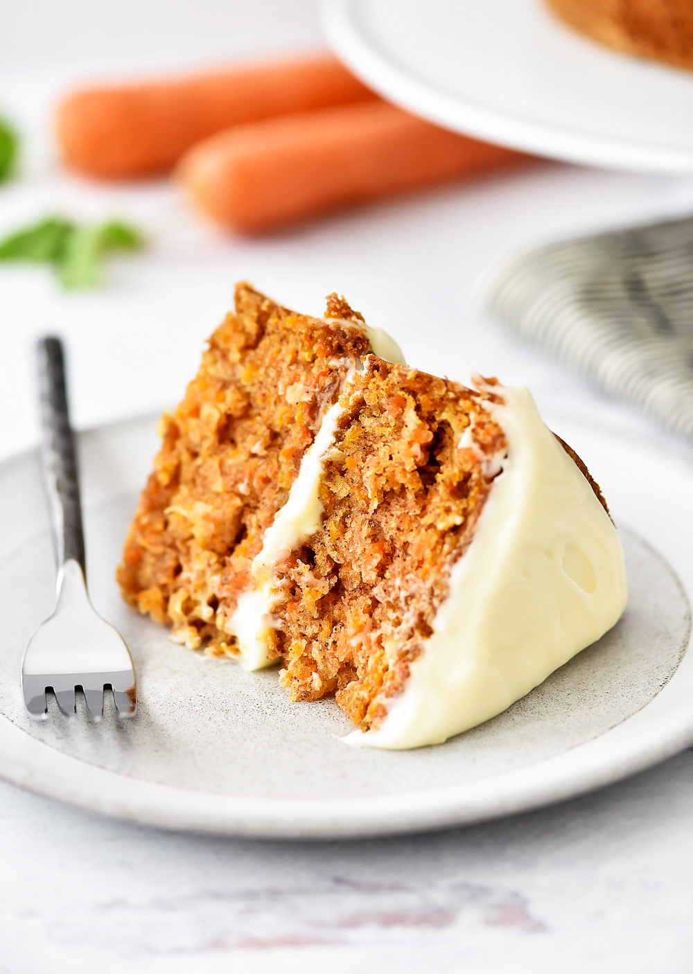 A delicious, moist cake filled with shredded carrots and coconut and topped off with a creamy Almond-Scented Cream Cheese Frosting. Life-in-the-Lofthouse.com