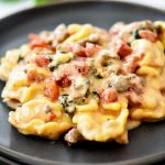 Sausage, cheese tortellini, spinach, diced tomatoes and cheese create this Slow Cooker Sausage and Cheese Tortellini. Life-in-the-Lofthouse.com