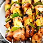 Teriyaki Chicken Kebabs are marinated pieces of chicken, with pineapple and bell pepper threaded onto skewers then grilled.