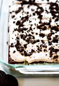 Layers of mint chocolate ice cream sandwiches, Cool Whip, and crushed Oreo cookie create one incredible dessert.