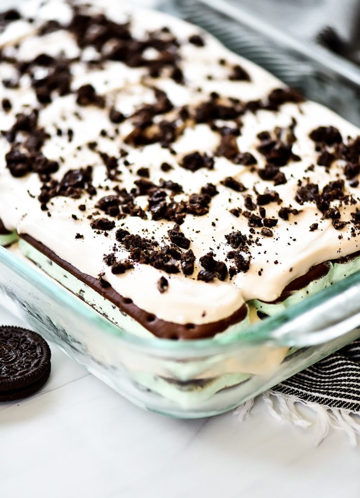 Layers of mint ice cream sandwiches, cool whip and crushed Oreo cookies create this delicious cake.