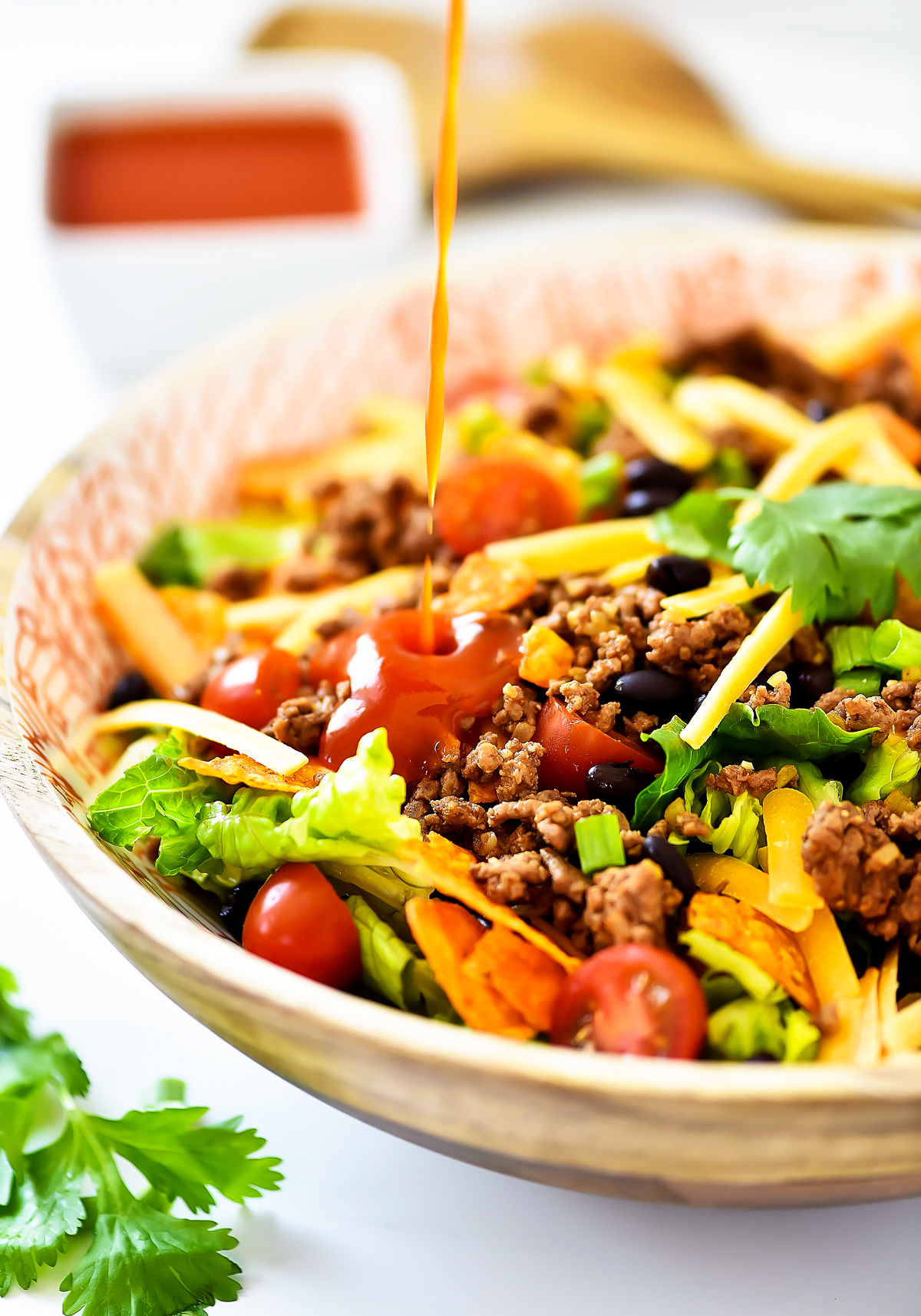 This Doritos Taco Salad is loaded with seasoned ground beef, black beans and of course, Nacho Cheese Doritos. Life-in-the-Lofthouse.com
