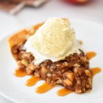 Deep Dish Apple Crisp is a thick layer of apples, cinnamon and sugary oats baked over a flaky pie crust. Life-in-the-Lofthouse.com