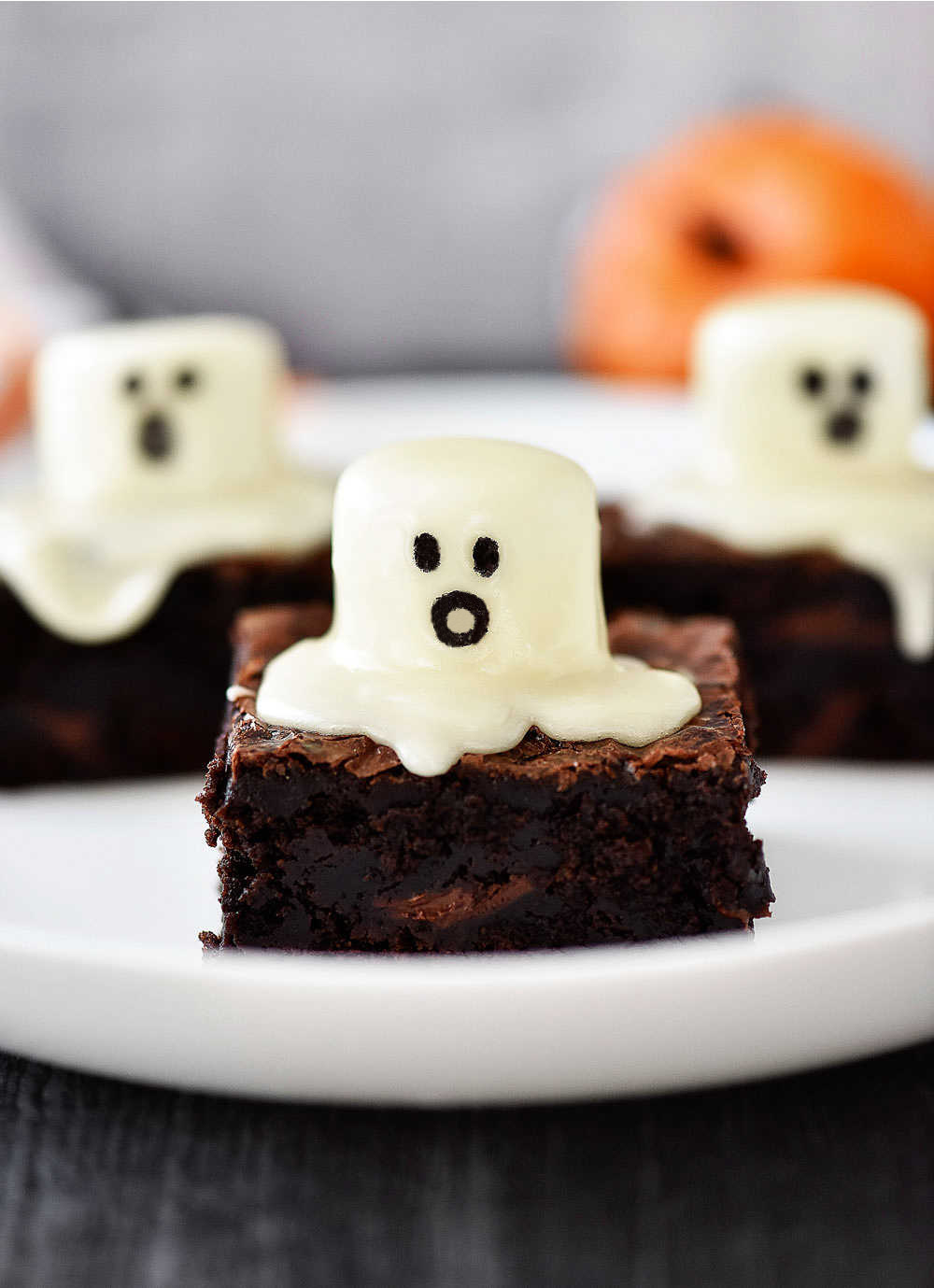 Ghost brownies are delicious, soft brownies with a large cake frosting covered marshmallow on top with an adorable ghost face. Life-in-the-Lofthouse.com