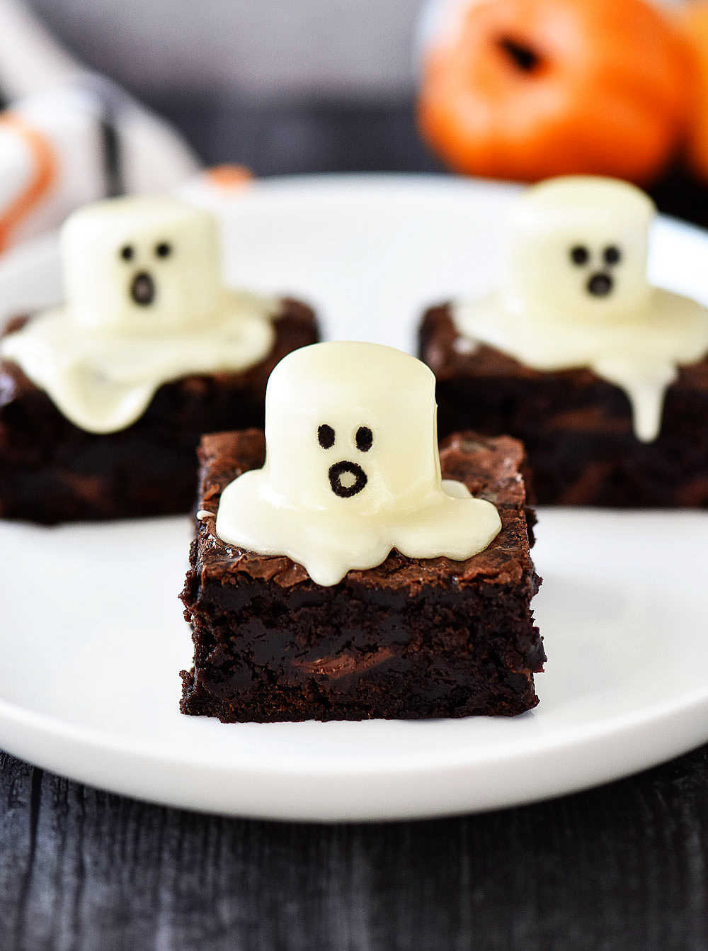 Ghost brownies are delicious, soft brownies with a large cake frosting covered marshmallow on top with an adorable ghost face. Life-in-the-Lofthouse.com