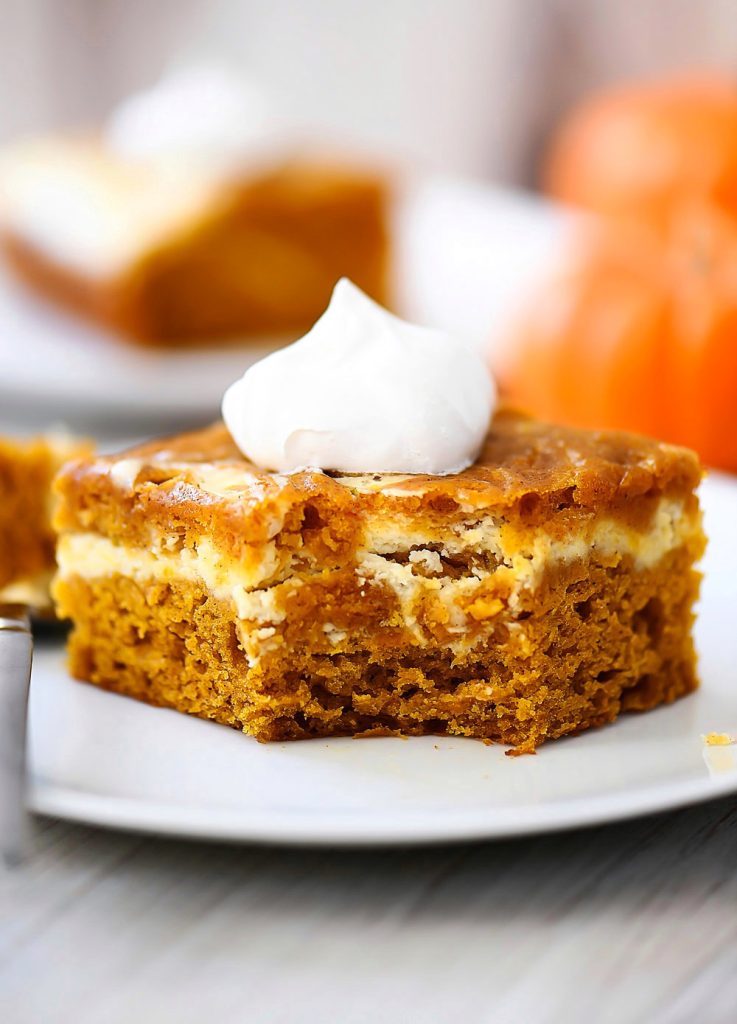 Pumpkin Roll Cake has layers of spice pumpkin cake with a cream cheese filling.