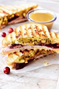 Thanksgiving Leftovers panini is filled with turkey, stuffing, cranberry sauce and Muenster cheese. Life-in-the-Lofthouse.com