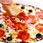 Warm Pizza Dip with two cheeses, pizza sauce and toppings.