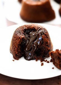Easy Chocolate Lava Cakes are mini chocolate cakes with a warm center of hot fudge, topped with a big scoop of vanilla ice cream and then drenched in chocolate magic shell. Life-in-the-Lofthouse.com
