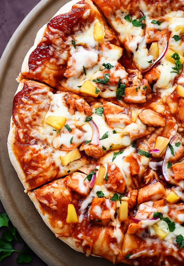 This Hawaiian BBQ Chicken Pizza is loaded with cheese, barbecue sauce, pineapple, red onion and cilantro. Life-in-the-Lofthouse.com