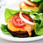 A flavorful burger topped with cheese, tomato, and a mouth-watering spread wrapped in lettuce. Life-in-the-Lofthouse.com