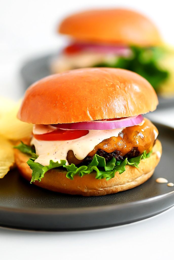Chipotle Ranch Burgers are juicy burgers fresh off the grill smothered in chipotle ranch dressing, cheese, lettuce and tomato. Life-in-the-Lofthouse.com