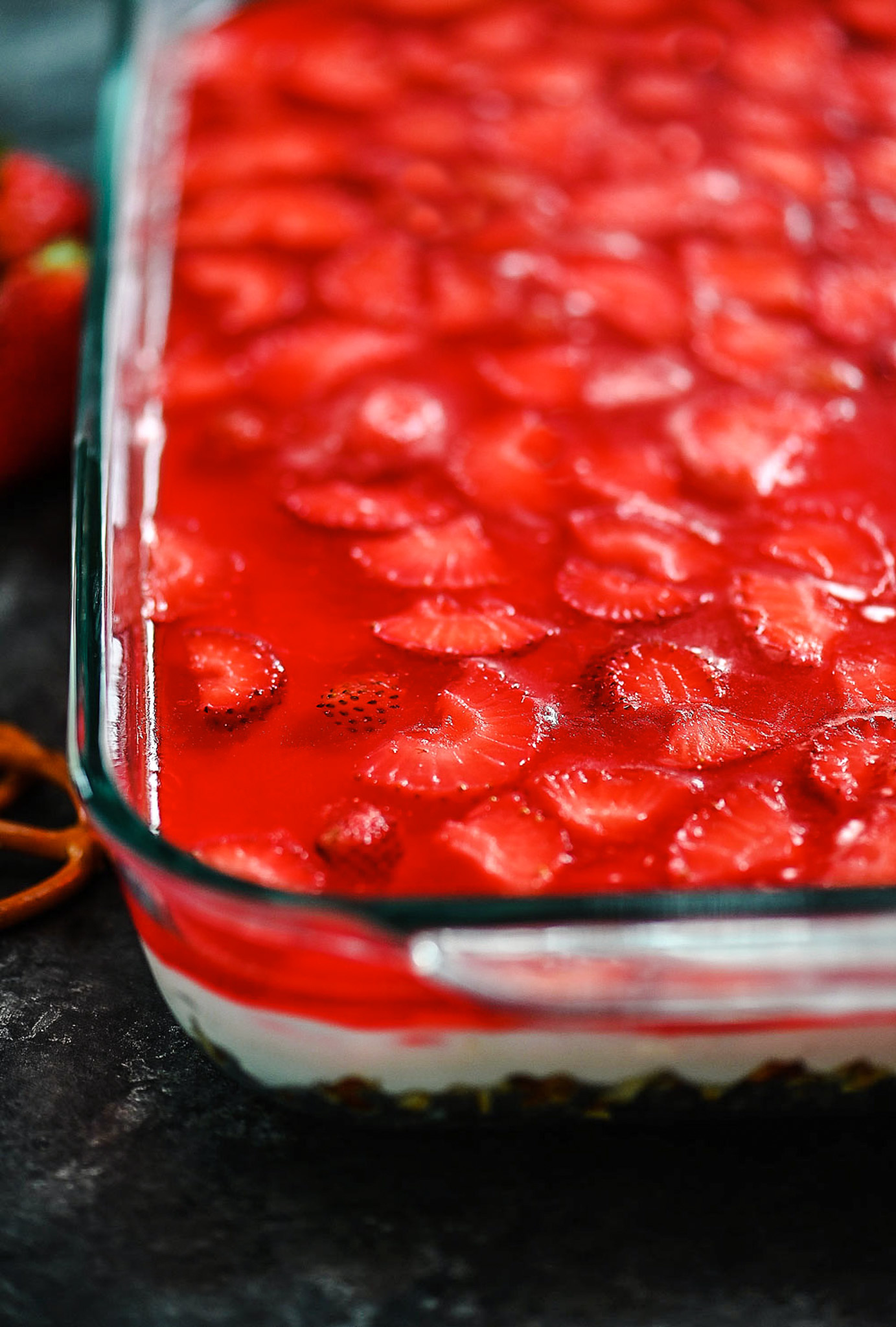 Pretzel salad with cream cheese filling and strawberries.