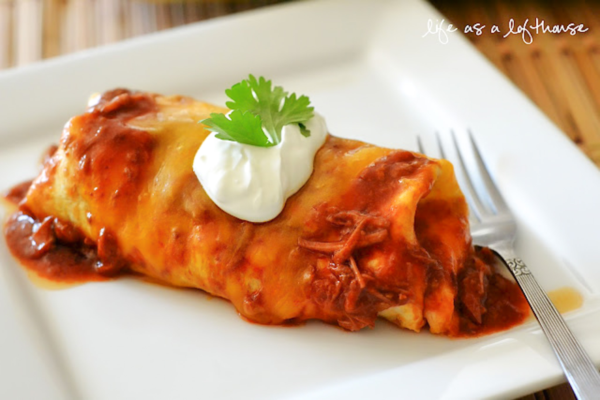 Chile Colorado Burritos are the most incredible and flavorful beef burritos you'll ever taste. The meat slow cooks in the crock pot, so you don't have to worry about it until you're ready to eat!