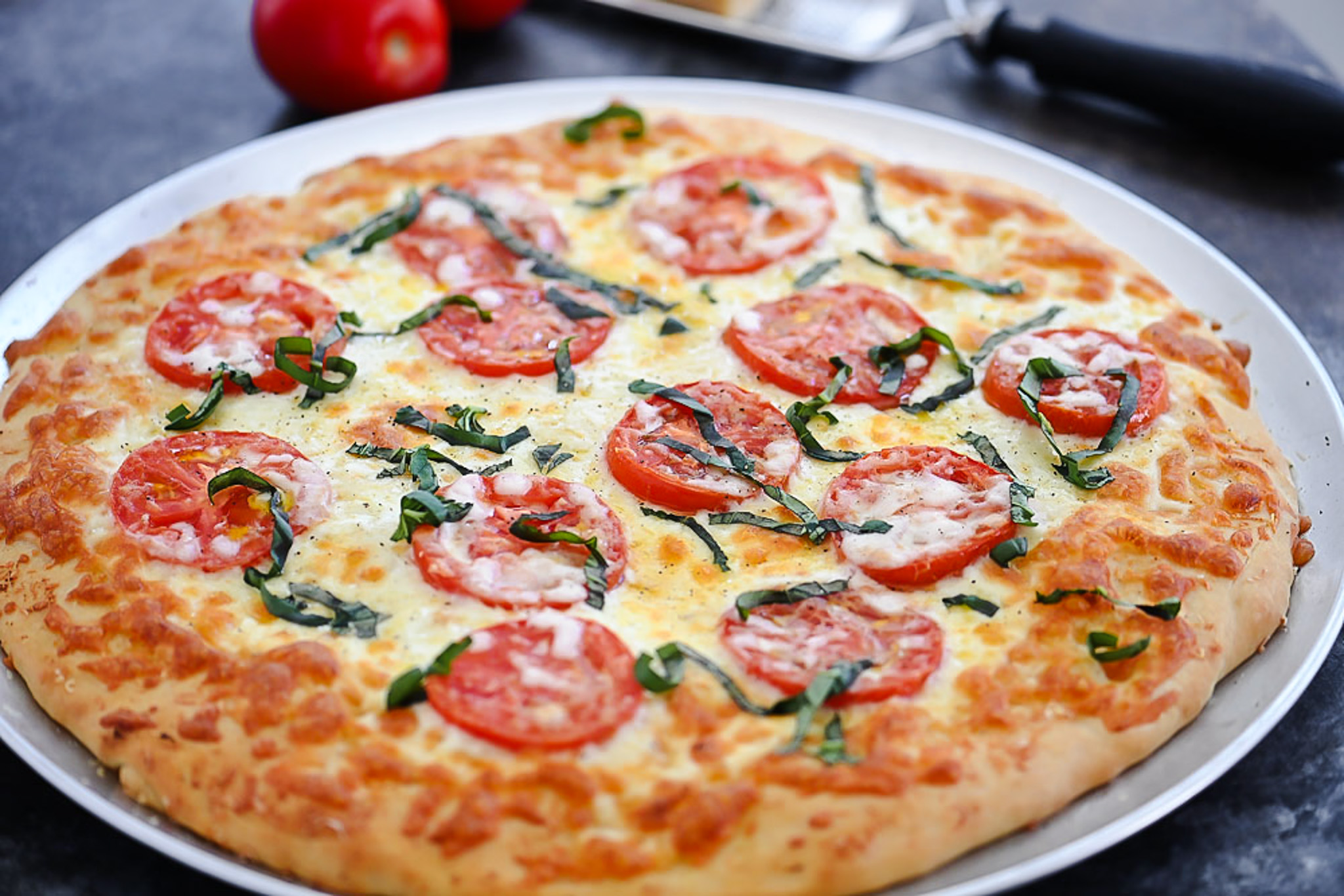 Margherita Pizza is topped with Mozzarella and Parmesan cheese, sliced tomatoes and fresh basil over pizza crust. Life-in-the-Lofthouse.com