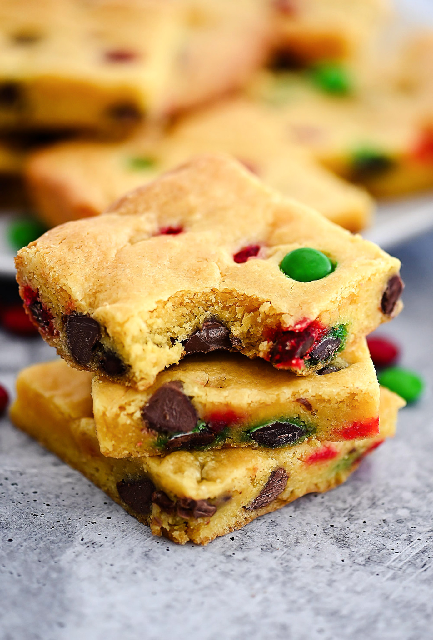 Cake Mix Cookie Bars are soft, chewy and loaded with chocolate chips and M&M's. Life-in-the-Lofthouse.com