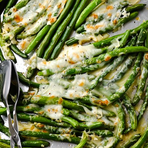green beans with punchy parmesan dressing These Smashed Green Beans with Parmesan & Balsamic take a flavorful twist on a classic roasted side. Smashing the beans creates extra surface area that catches a coating of Parmesan and garlic, adding