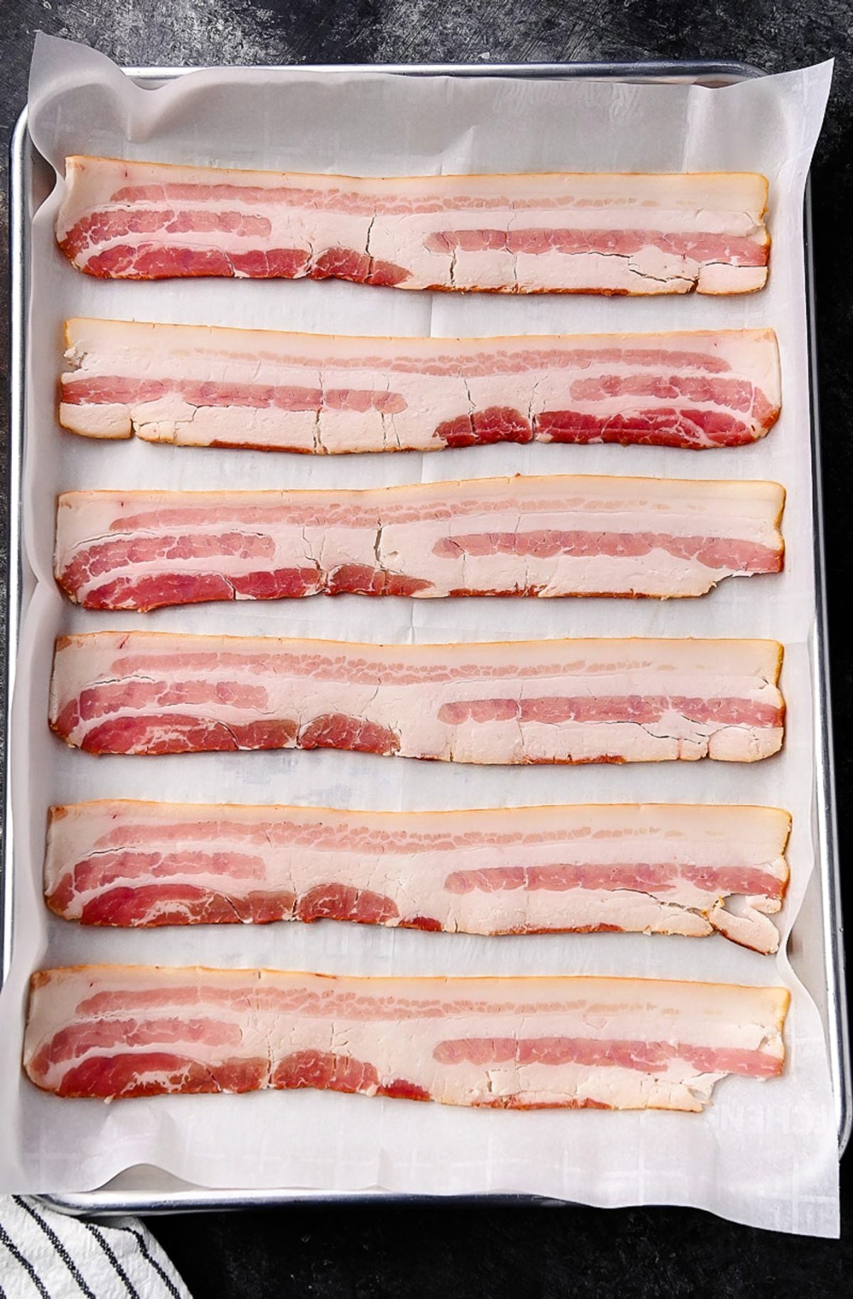 Bacon slices on a sheet pan