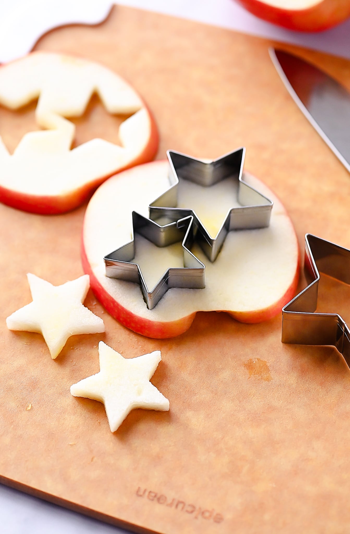Apple slices cut into stars with a star cookie cutter.