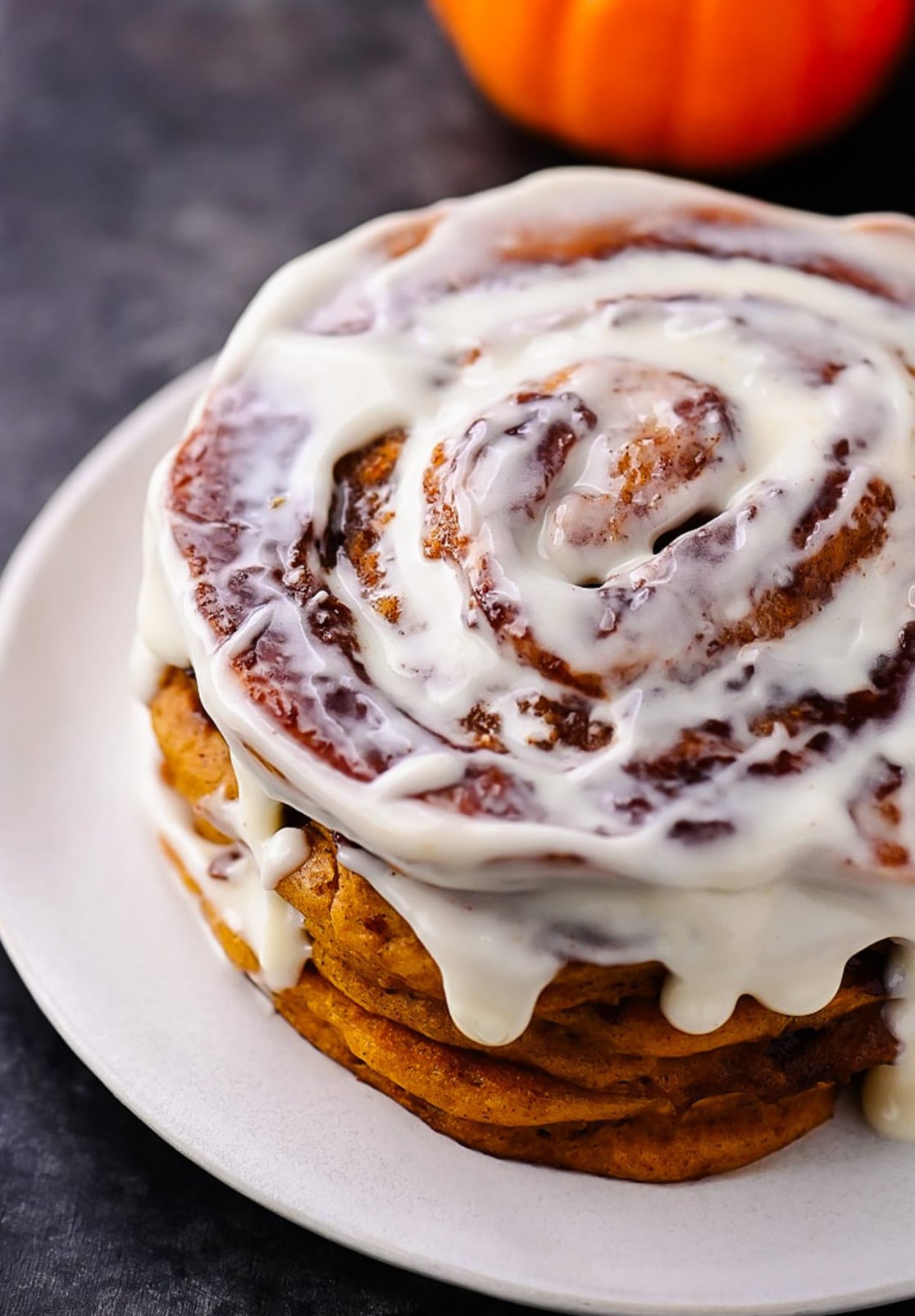 Pumpkin Cinnamon Roll Pancakes with Cream Cheese Glaze